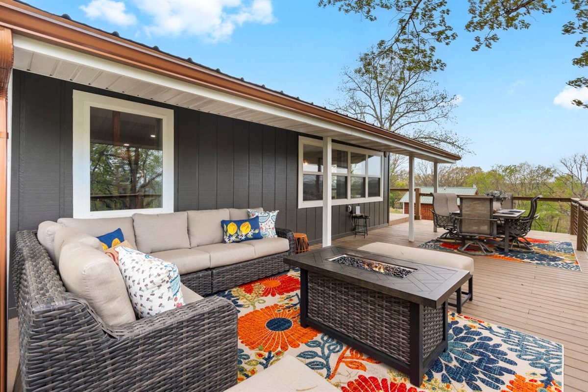 Cozy back deck with fire table and mountain views.