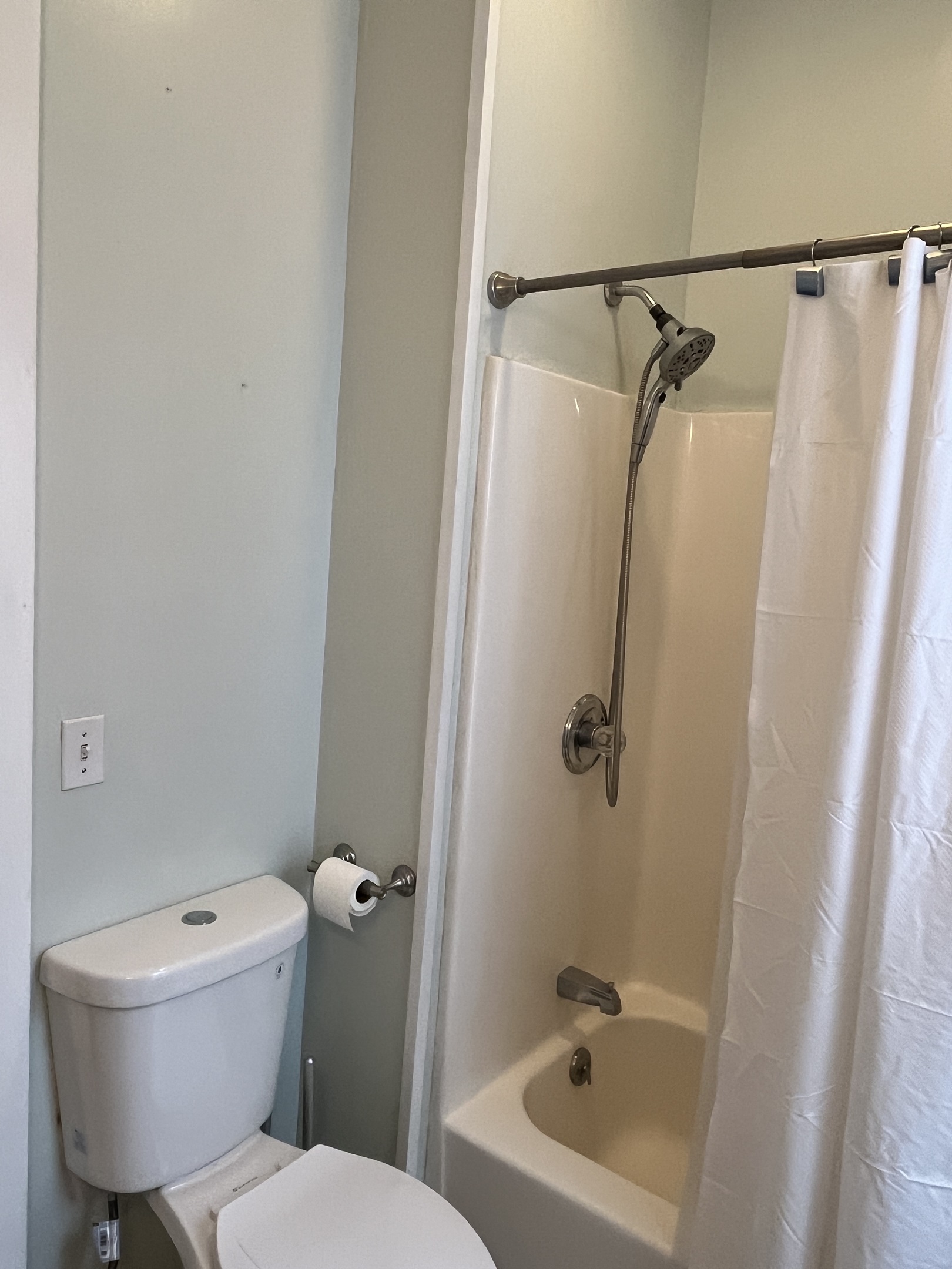 Bathroom with tub/shower, steps from each bedroom