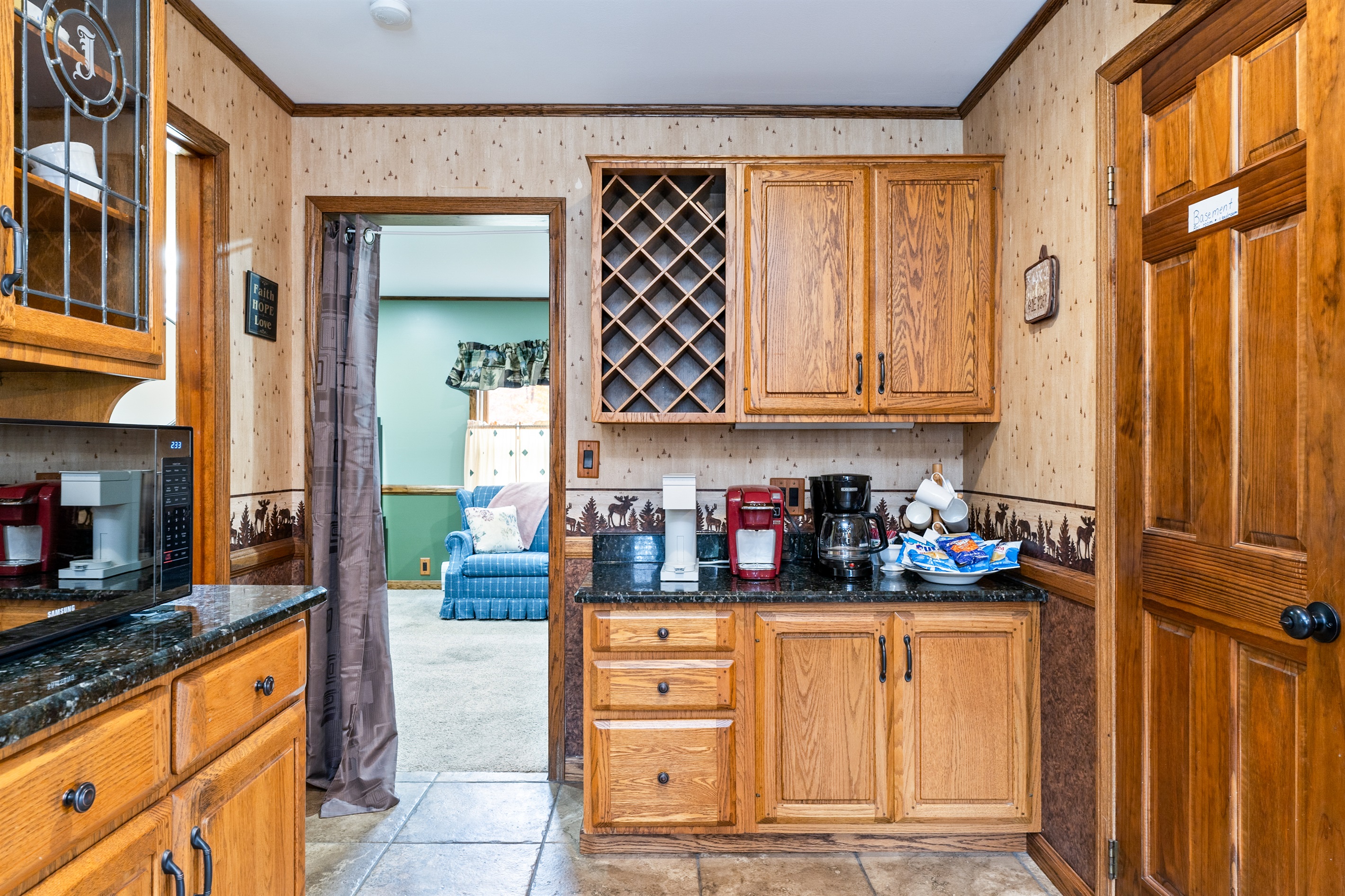 Spacious kitchen with oak cabinetry and a built-in wine rack—perfect for entertaining or enjoying a cozy night in
