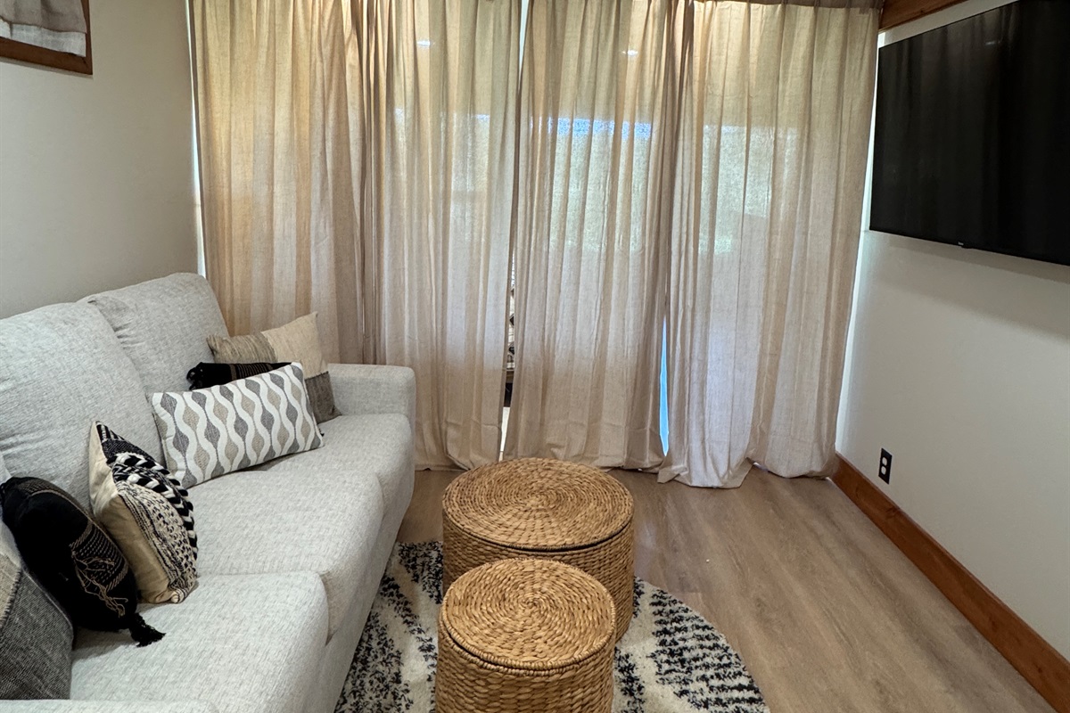 Privacy curtain between lounge area and King bed