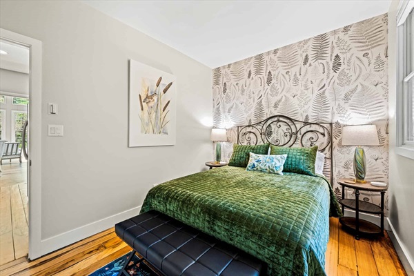 The guest bedroom with queen bed provides an authentic cozy cottage feeling.