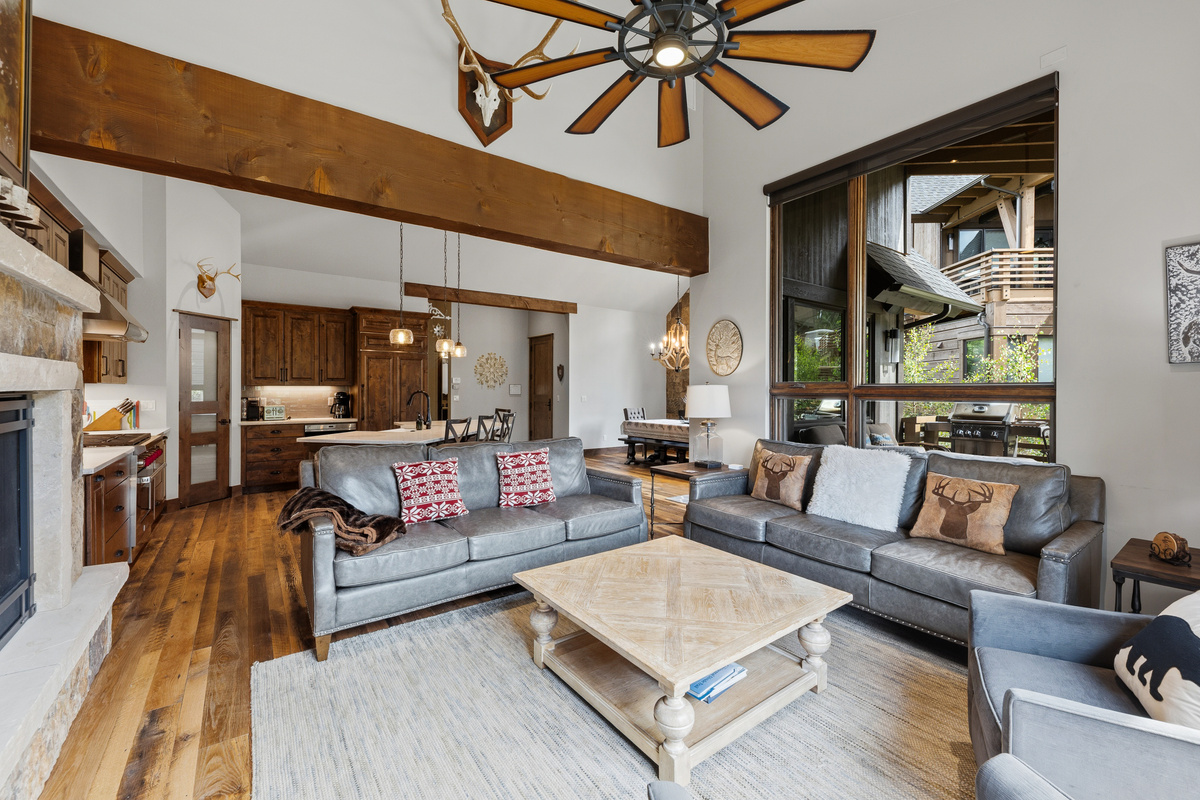 Main living area with vaulted ceilings and large windows