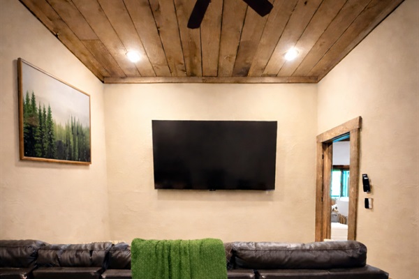 The movie room is the ultimate spot to kick back, featuring oversized seating and a big-screen 90&rdquo; TV for movie marathons or game days.