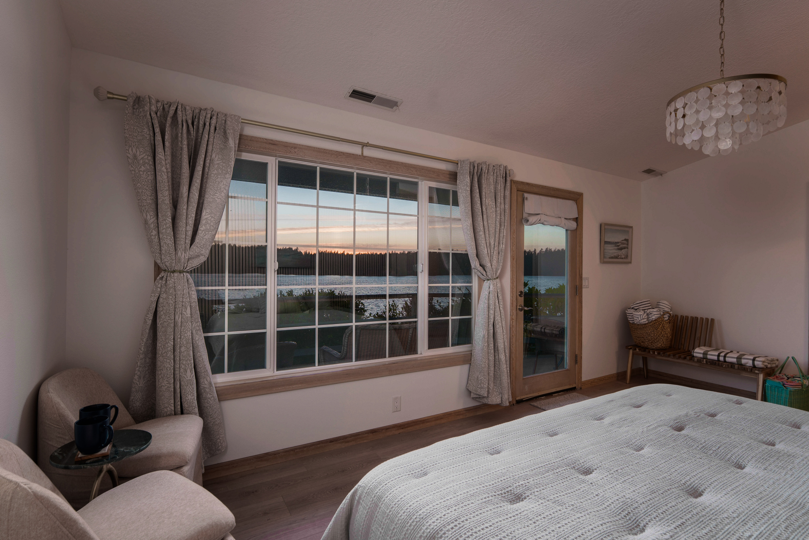 Wake to peaceful lake views from this king bedroom for two, complete with an adjoining nursery and convenient access to Bathroom 3, shared with Bedroom 3.