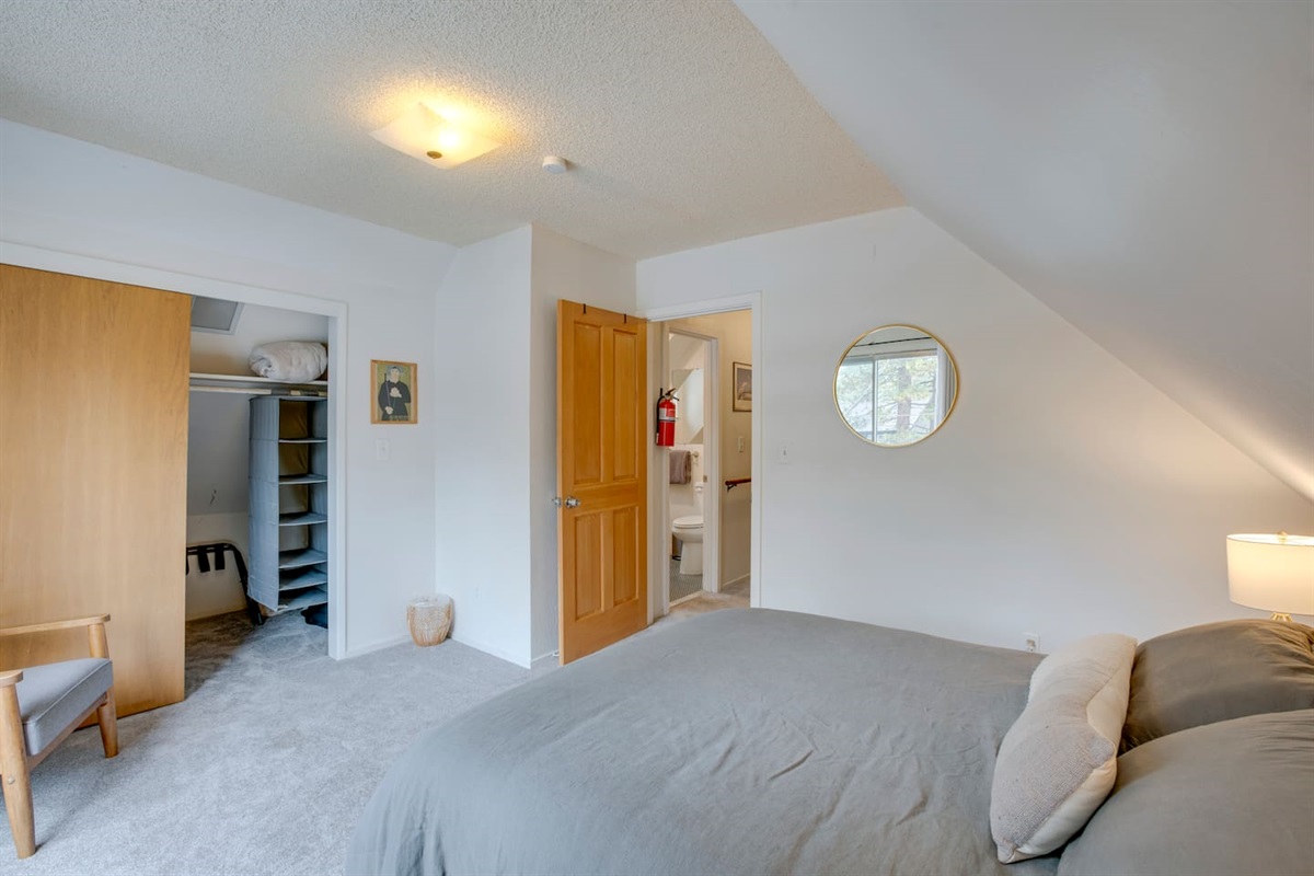 Upstairs bedroom with an attached balcony