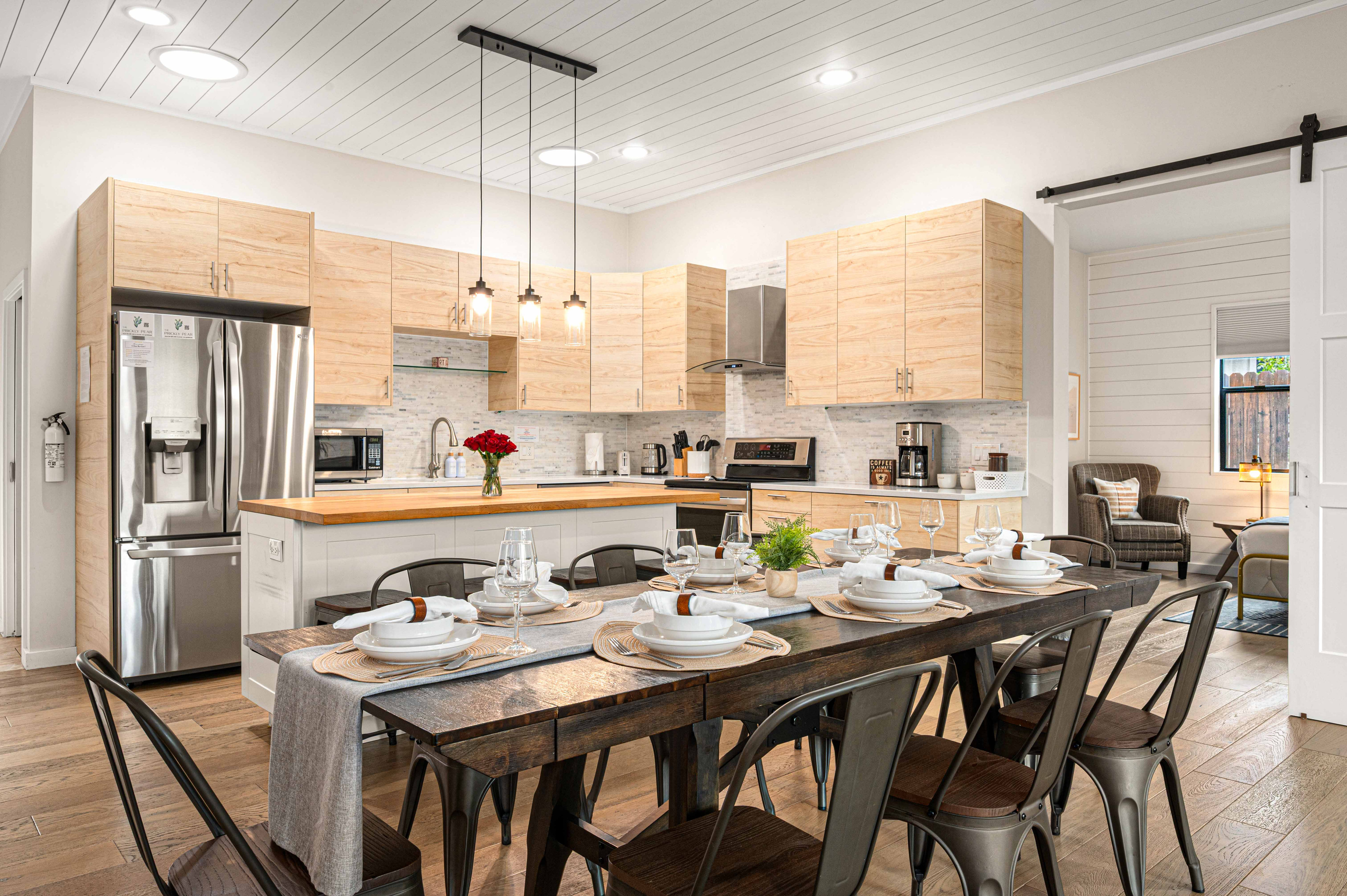 {Kitchen + Dining} The open kitchen and dining space makes group meals easy while keeping everyone connected.