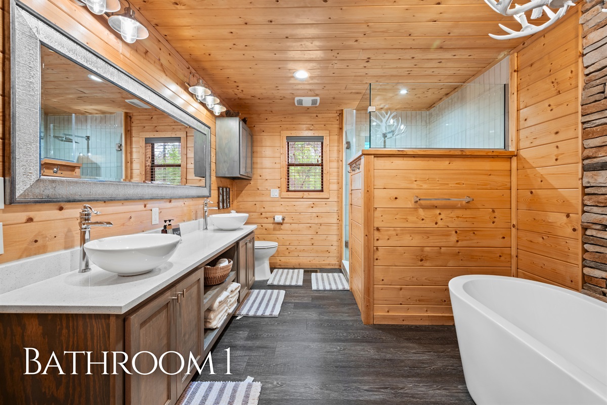 The bathroom features a clean, spacious layout that feels both functional and easy to move around in.
