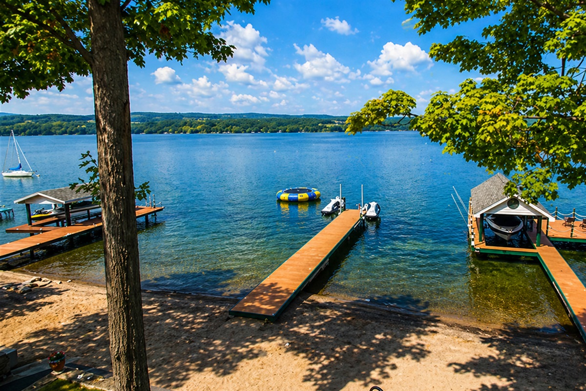 Take in stunning panoramic views and enjoy direct lake access with sandy shoreline, swim platforms, and docks.