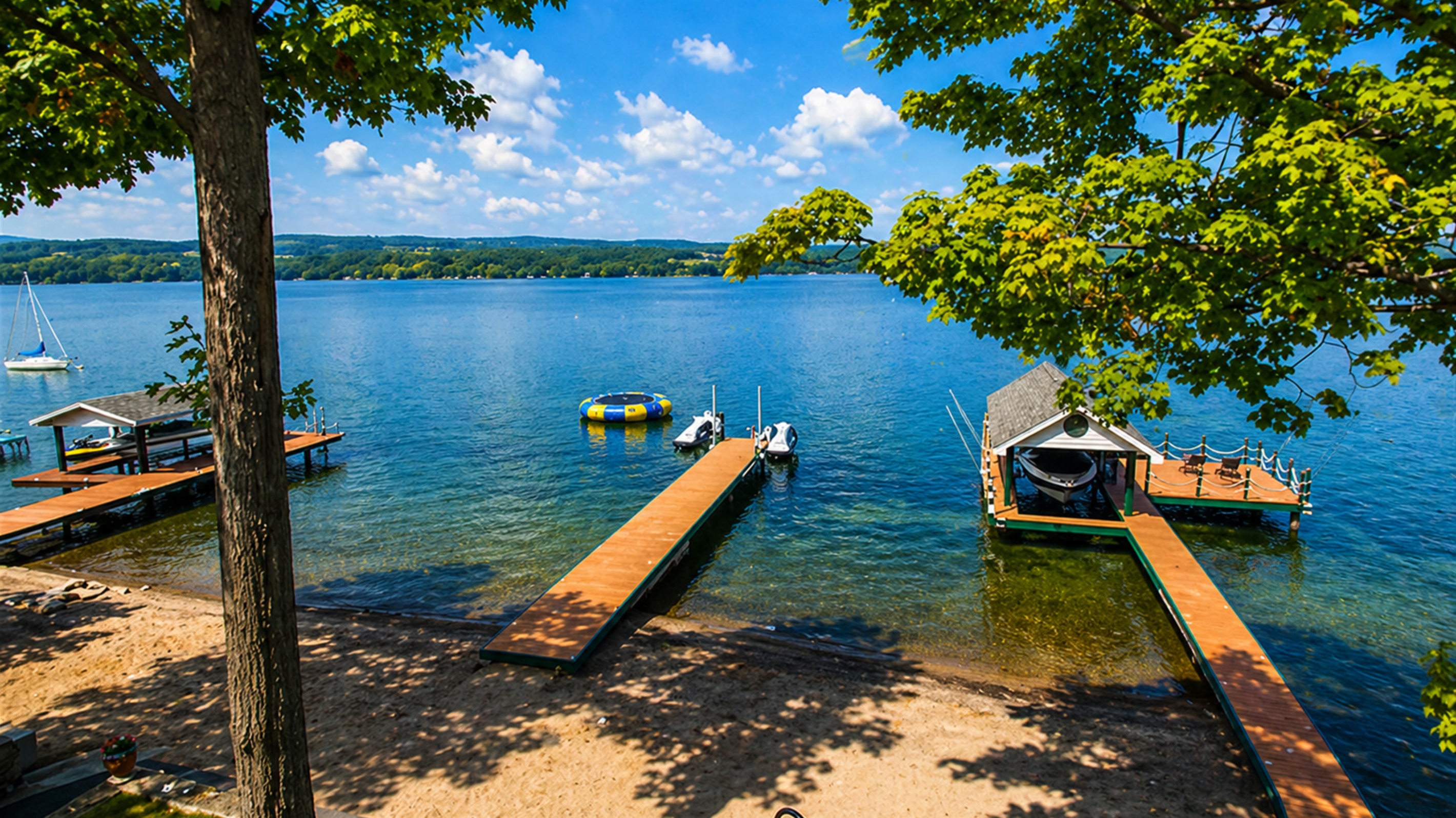 Take in stunning panoramic views and enjoy direct lake access with sandy shoreline, swim platforms, and docks.
