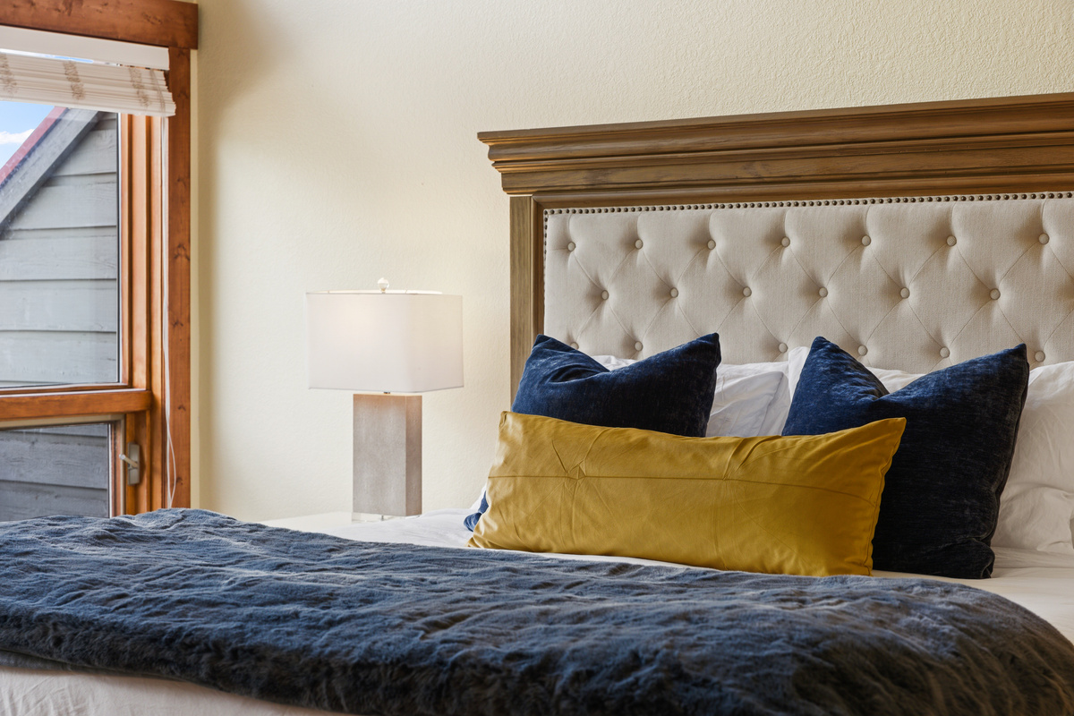 The primary King bed is brand new as of June 2026 with Tempur-Pedic mattress. Warm colors and textures give this large room a cozy feel. 