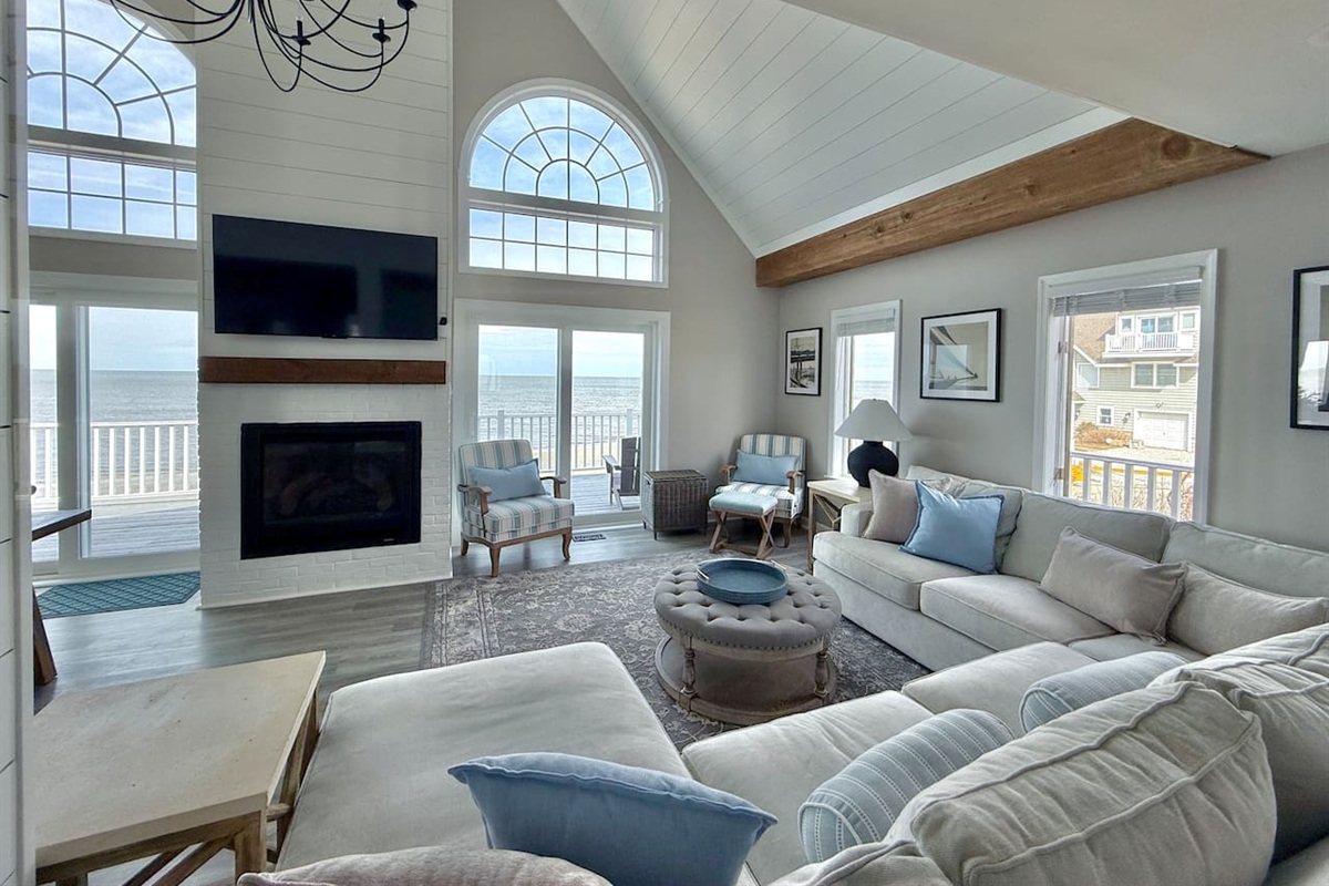 Sink into the plush comfort of this inviting lounge, perfectly positioned to capture breathtaking ocean views. With a cozy fireplace and serene atmosphere, it is the ultimate setting for families and friends to relax and cherish every moment of vacation.