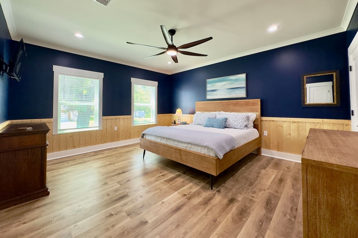 Enjoy a bright, airy bedroom with modern comfort and charm.