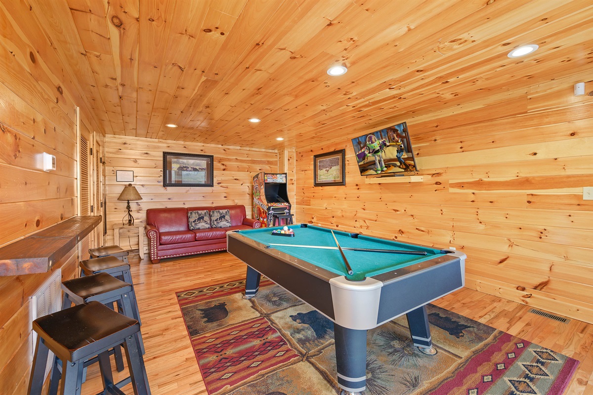 Lower level game room: Pool table and 2 multi-cade arcade games