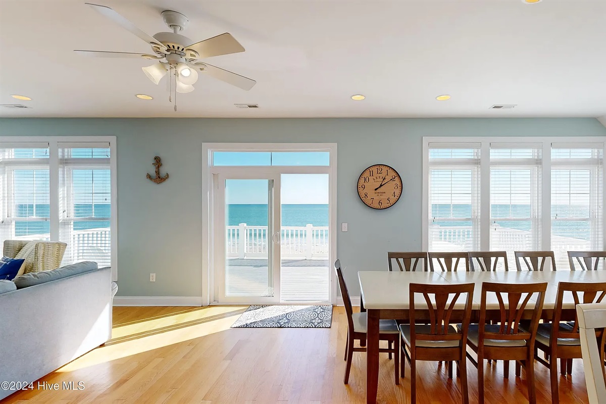 Dining room flooded with light and endless sea views
