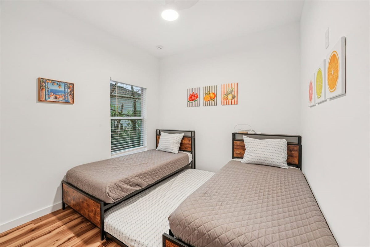Third bedroom has 2 twin beds, with a 3rd twin bed trundle under the left bed with extra blanket and pillow in the closet.