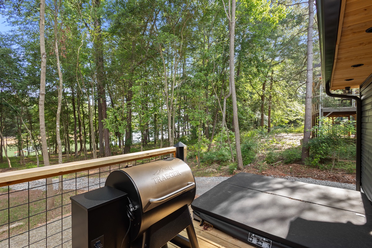 Lakeside porch with grill and hot tub. 