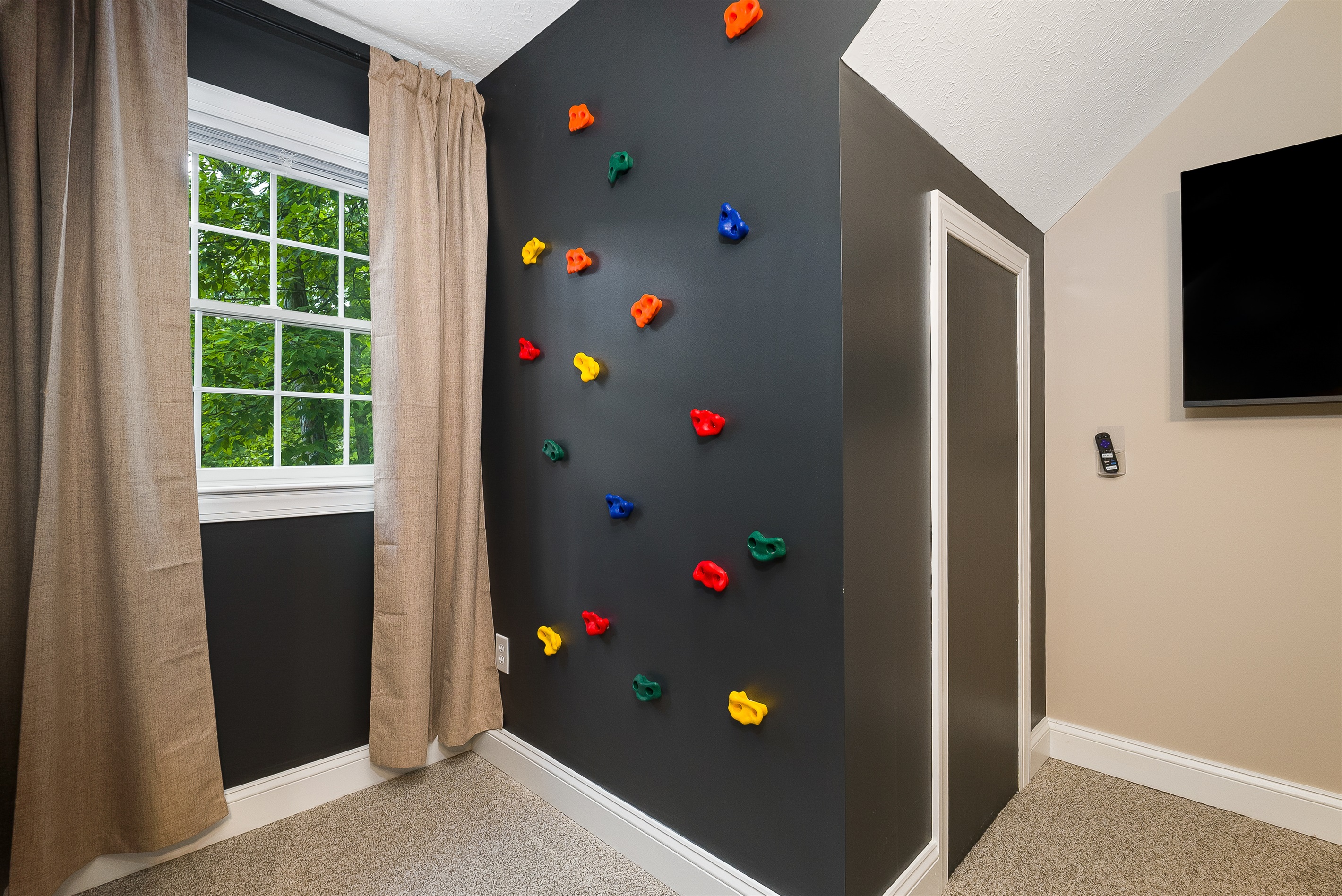 A colorful indoor rock wall for safe and exciting play.