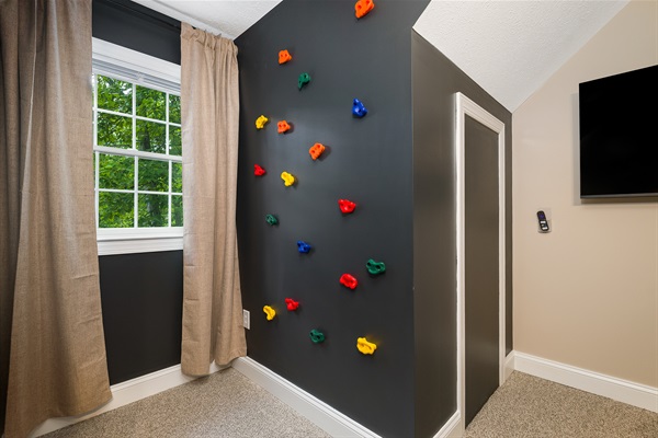 A colorful indoor rock wall for safe and exciting play.