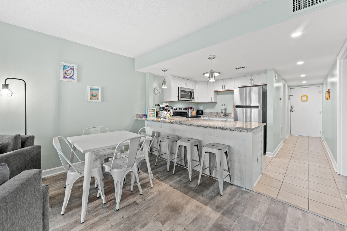 Dining area and breakfast bar with seating for 4