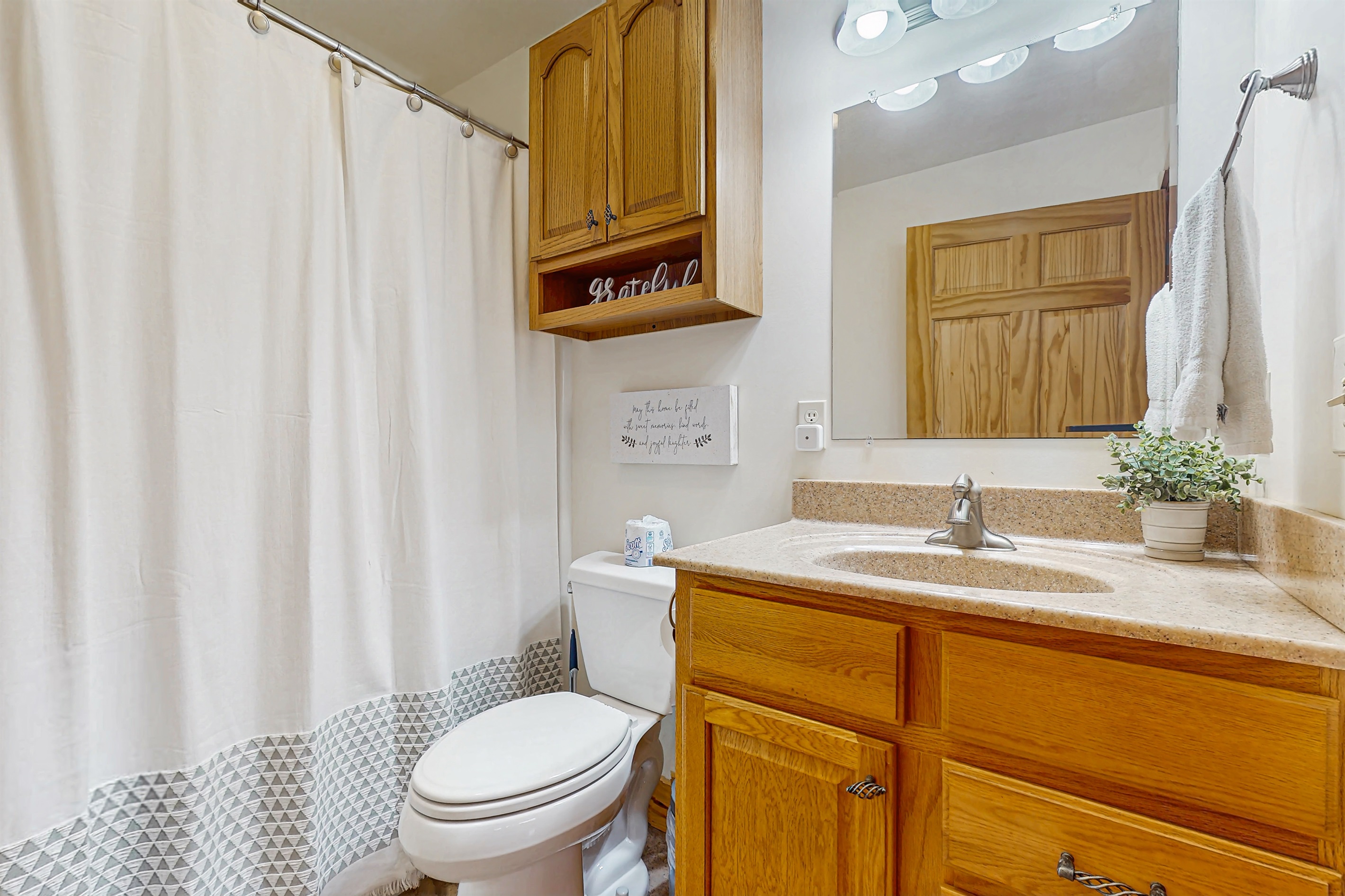 Upstiars bath with shower / tub combo. Accessible from hallway