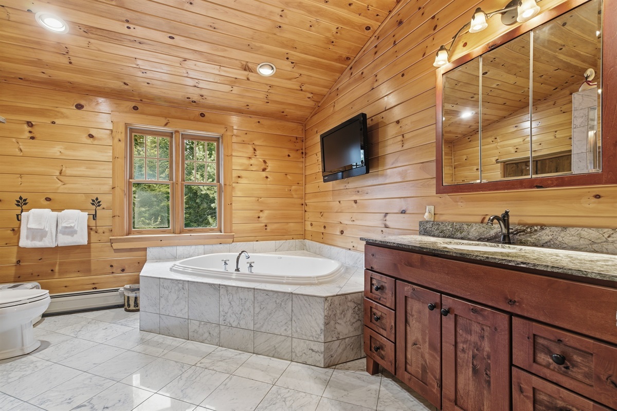 Enjoy a spa-like start or end to your day in the spacious primary bathroom.