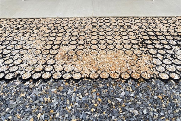 Detail of stabilized gravel entry & cement porch.