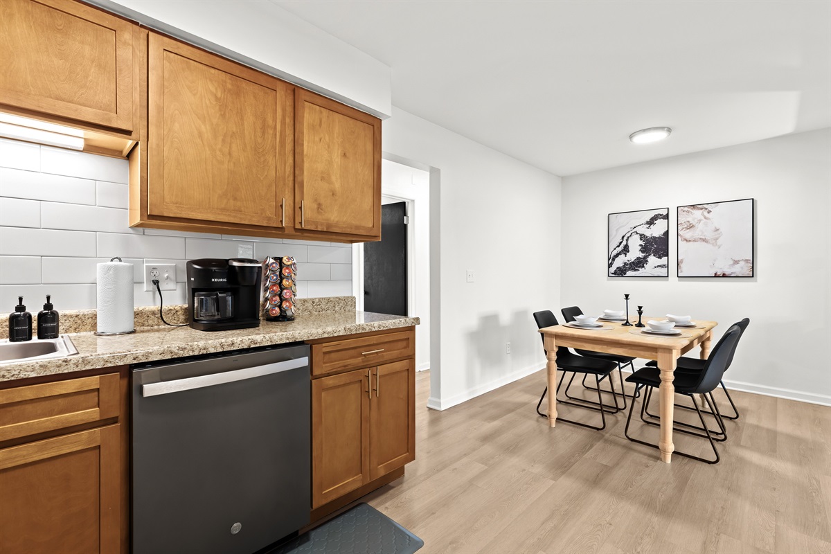 Dine in style at this intimate table set for four, conveniently close to the kitchen.