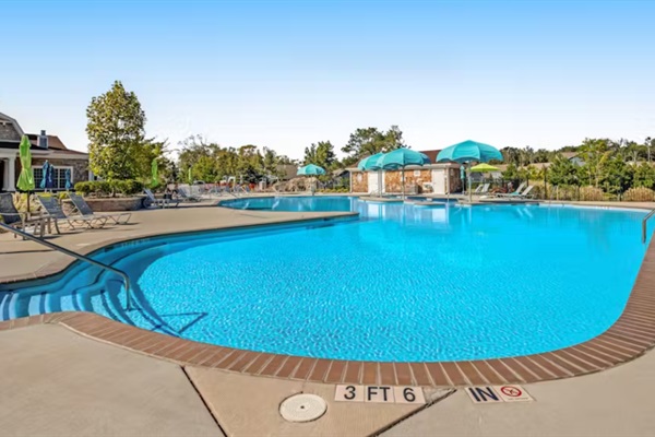 Main pool depth markers visible, showing a gradual slope from 3 to 6 feet—ideal for swimmers of all abilities.