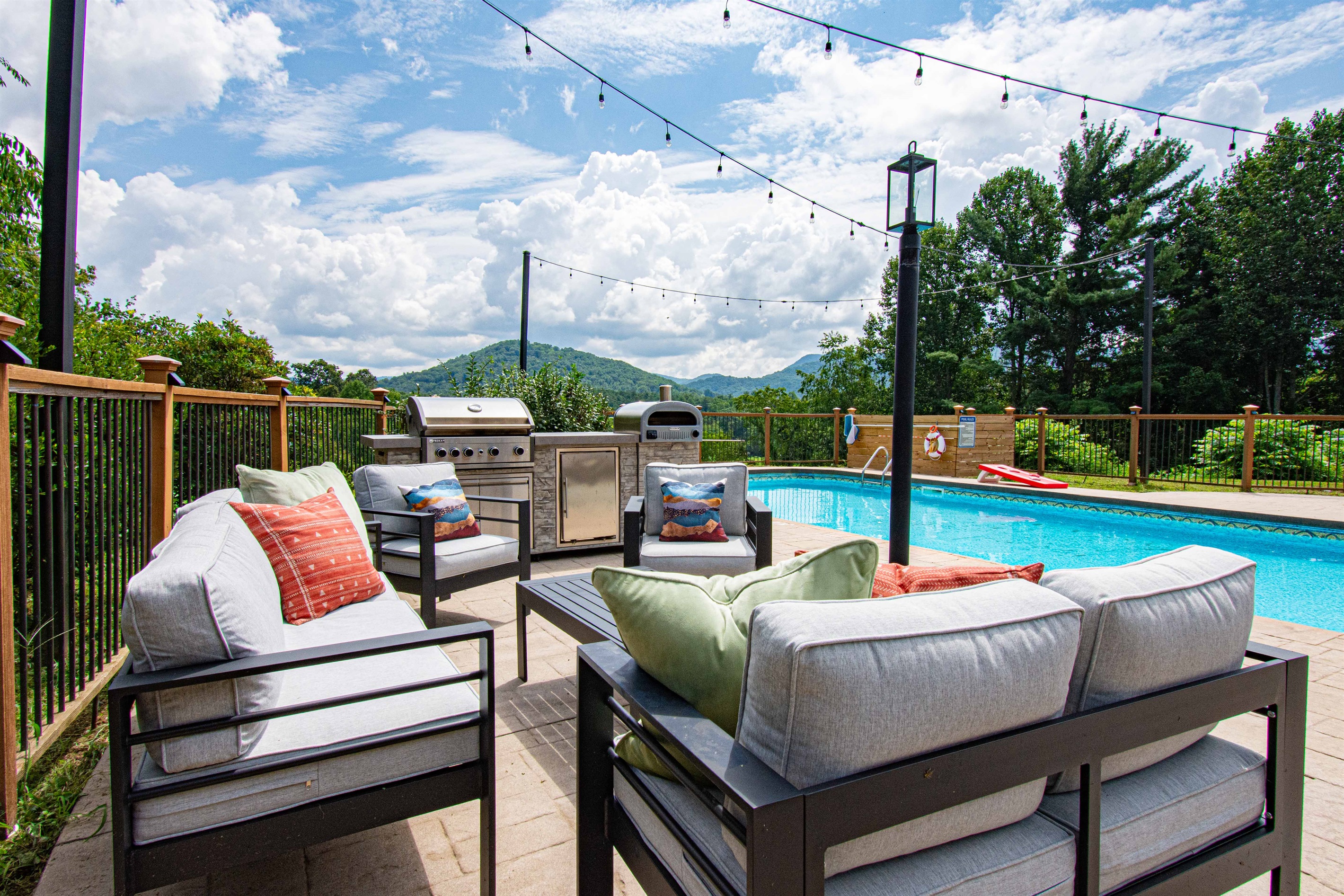 Lounge poolside with plush seating, mountain views, and the grill just steps away—perfect for afternoons that stretch lazily into evening gatherings.🌞🍹