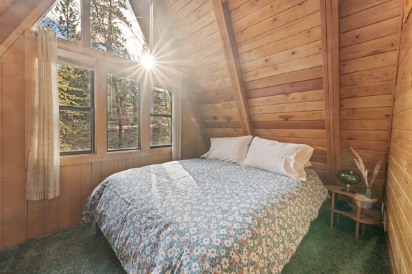 Guest bedroom with queen bed located upstairs