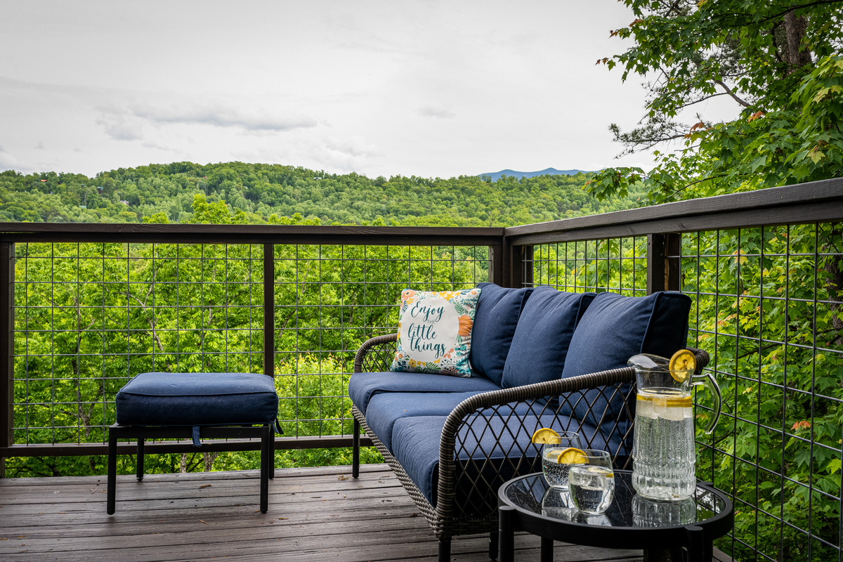 Couch on the main level deck is a perfect place to relax!