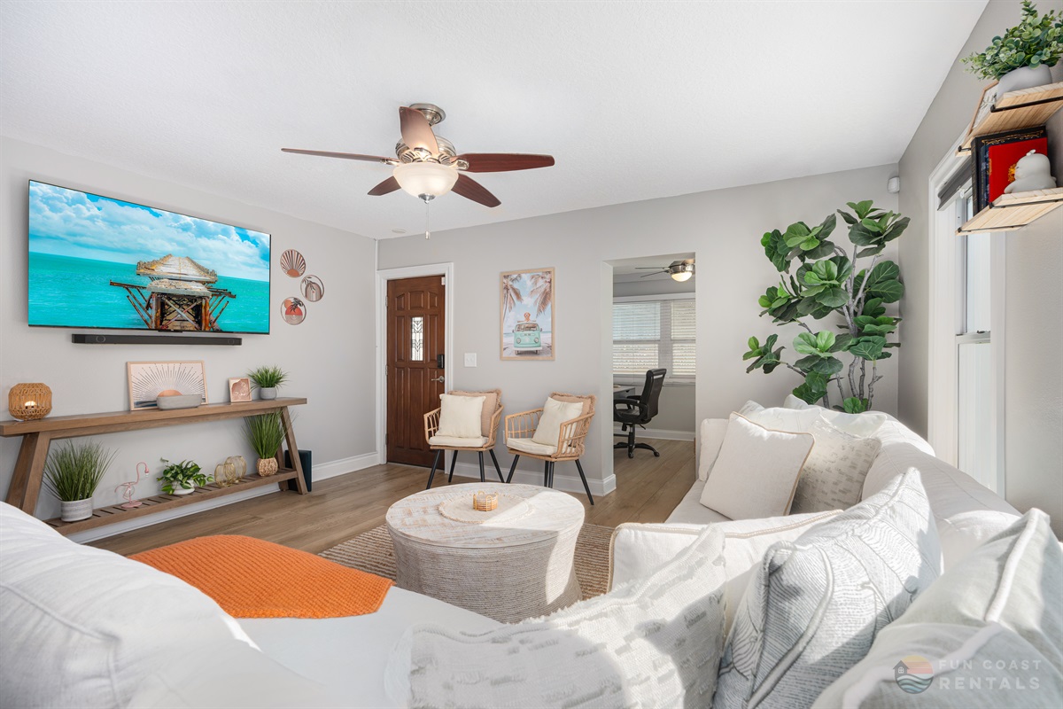 Spacious Living Room area with ample lounging space and 65" Smart TV