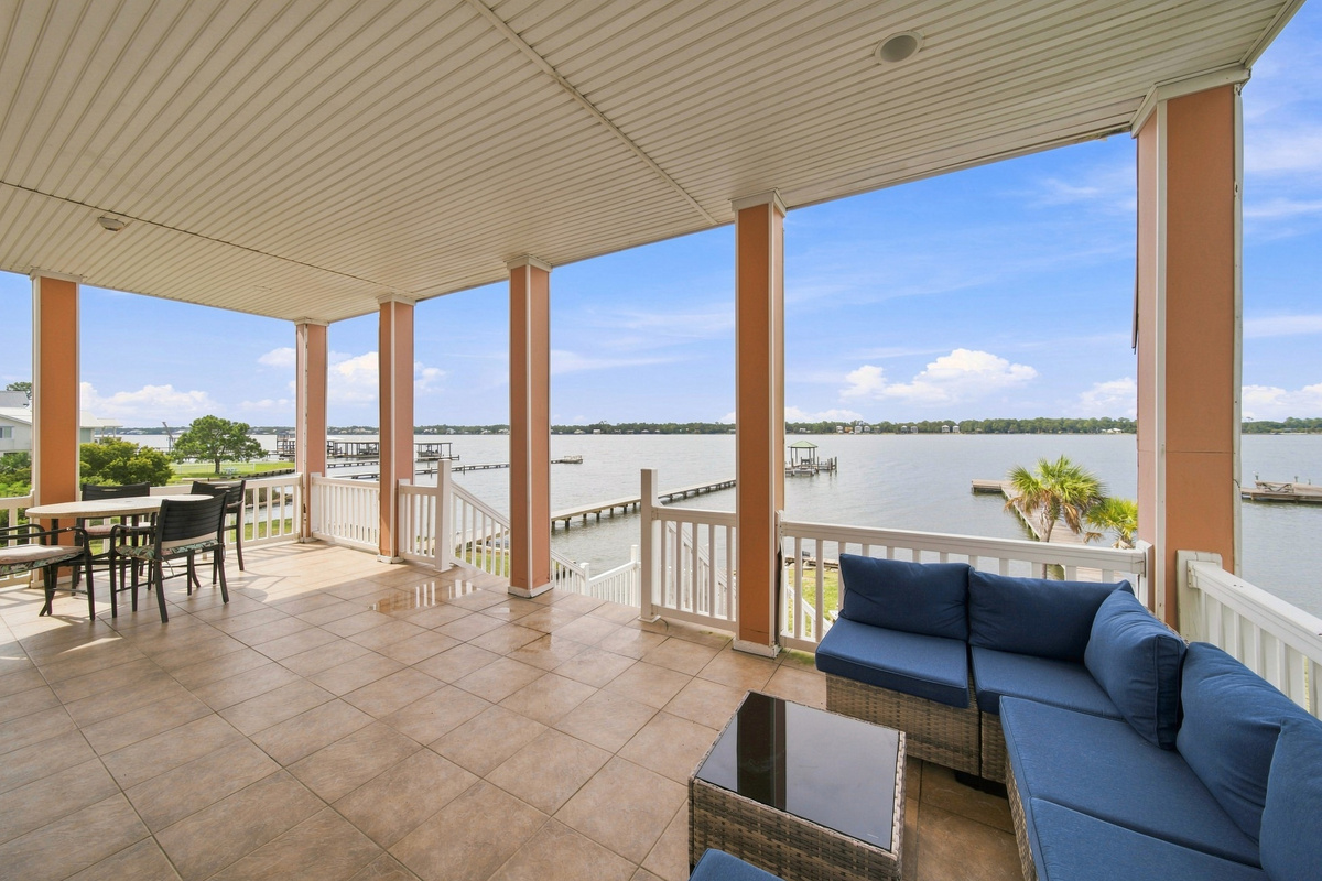 Relax on the covered balcony with panoramic lagoon views
