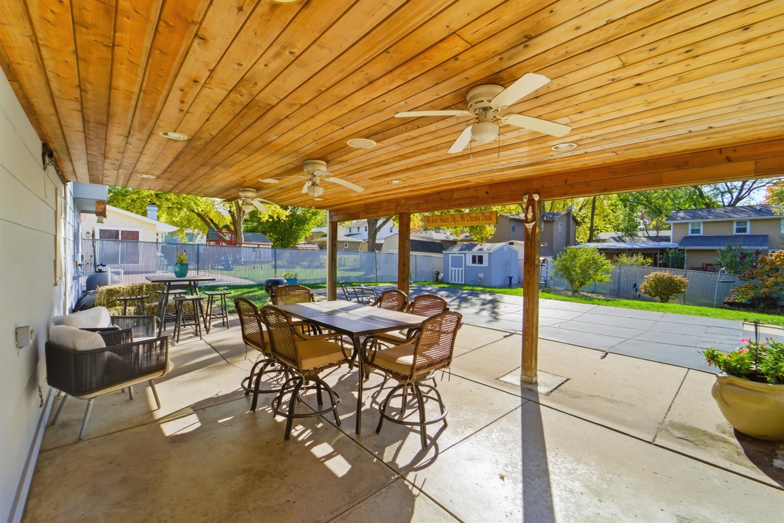 The covered patio in the backyard is a host's dream! With seating for 12 and a BBQ, there is plenty of space for the entire family to enjoy!