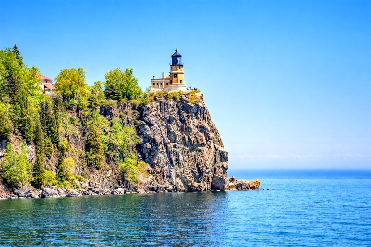 Split Rock Lighthouse the iconic North Shore view rising dramatically from the rocky shoreline. Seen from the beach with the lighthouse perched on the ledge above Lake Superior, this is a must-see stop and just 20 minute drive from the cabin.
