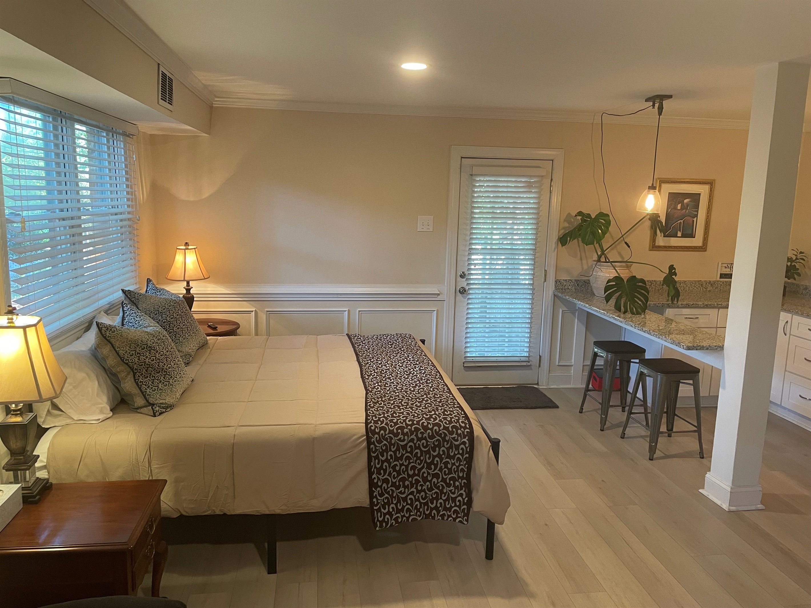 The lower primary suite has it's own over sized sitting area, kitchenette, mini fridge with freezer, full sized laundry units free for guests, walk in closet, and large bath and shower area.