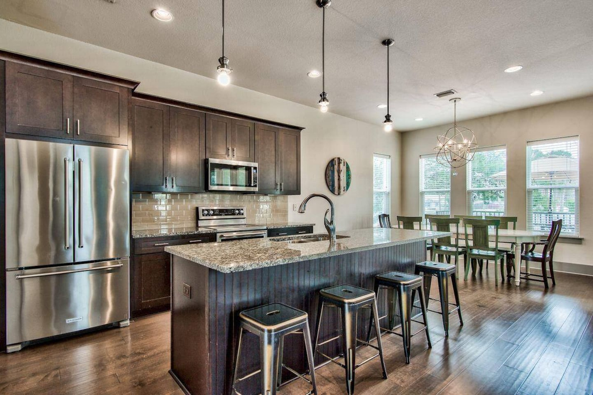 Kitchen and dining area next to living room
