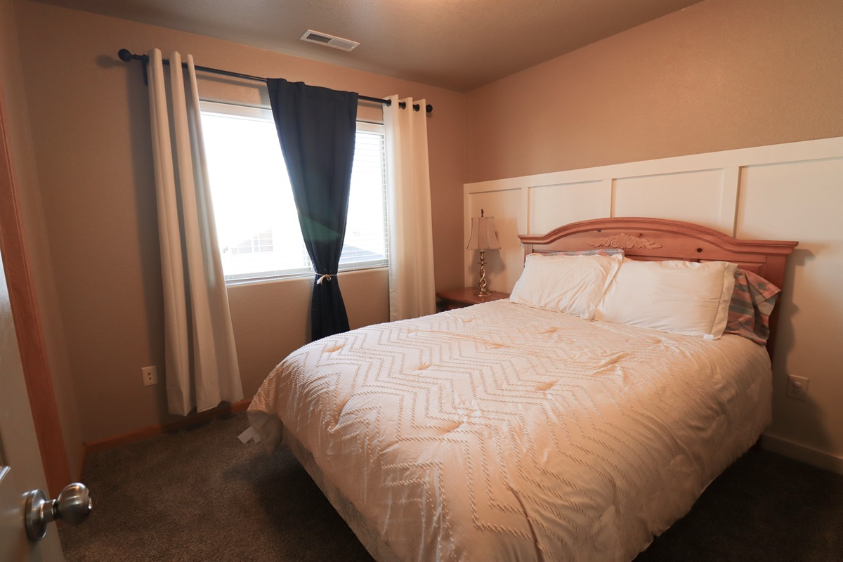 Bedroom three with queen bed