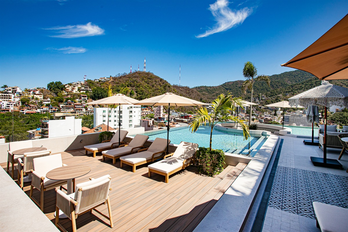 Sunbathe in comfort on the rooftop chaise lounges while enjoying panoramic views and perfect Puerto Vallarta breezes.