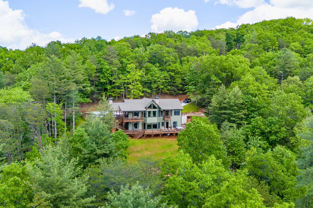 The chalet's exterior blends seamlessly with its natural surroundings, offering a welcoming first impression.