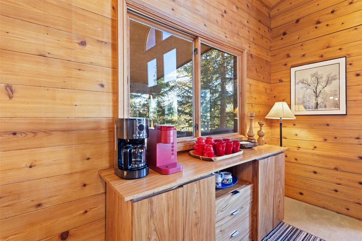 Coffee bar next to kitchen and dining table