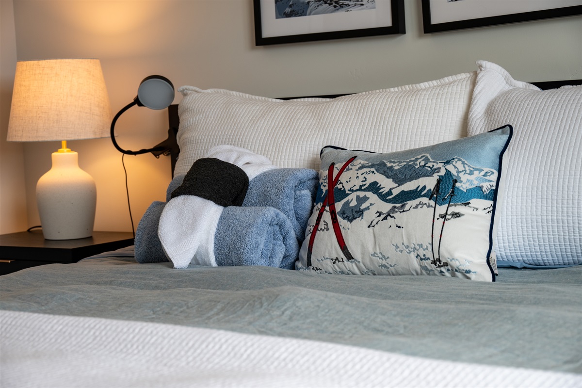 Thoughtful bedroom details with cozy textures and warm lighting.