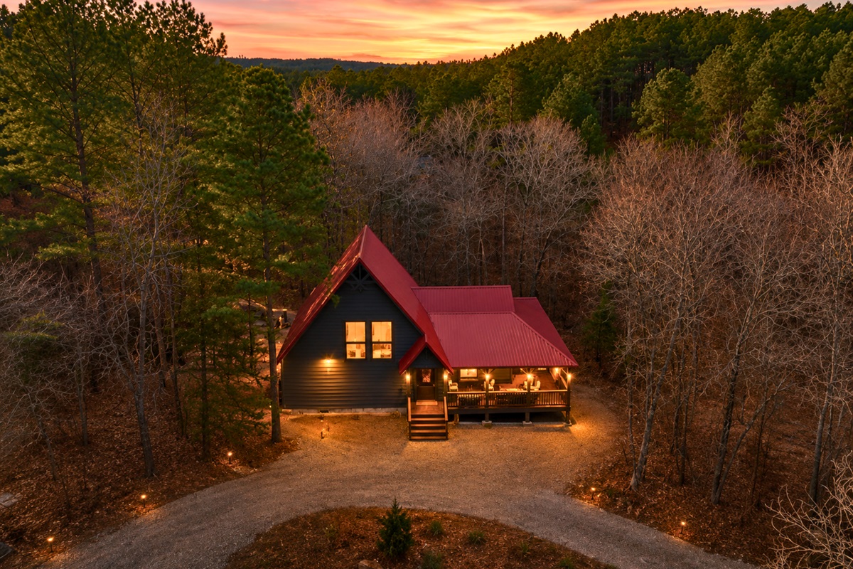 Glowing softly in the evening light, the cabin feels like the perfect secluded retreat for relaxing and reconnecting with nature.