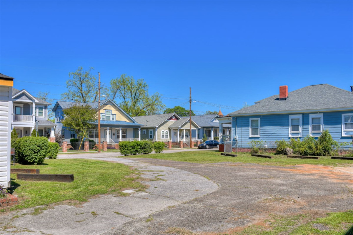 Expansive lot with multiple structures and open space.