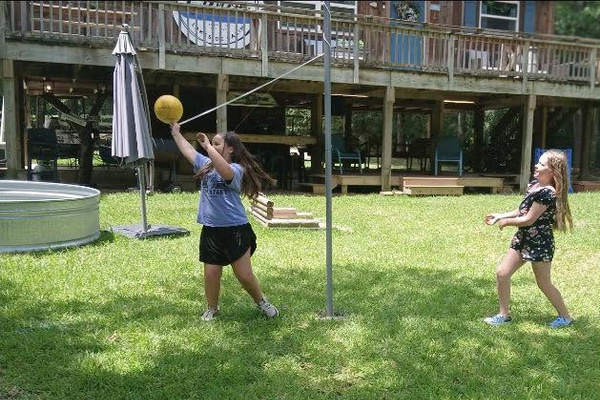 Having fun playing tether ball!
