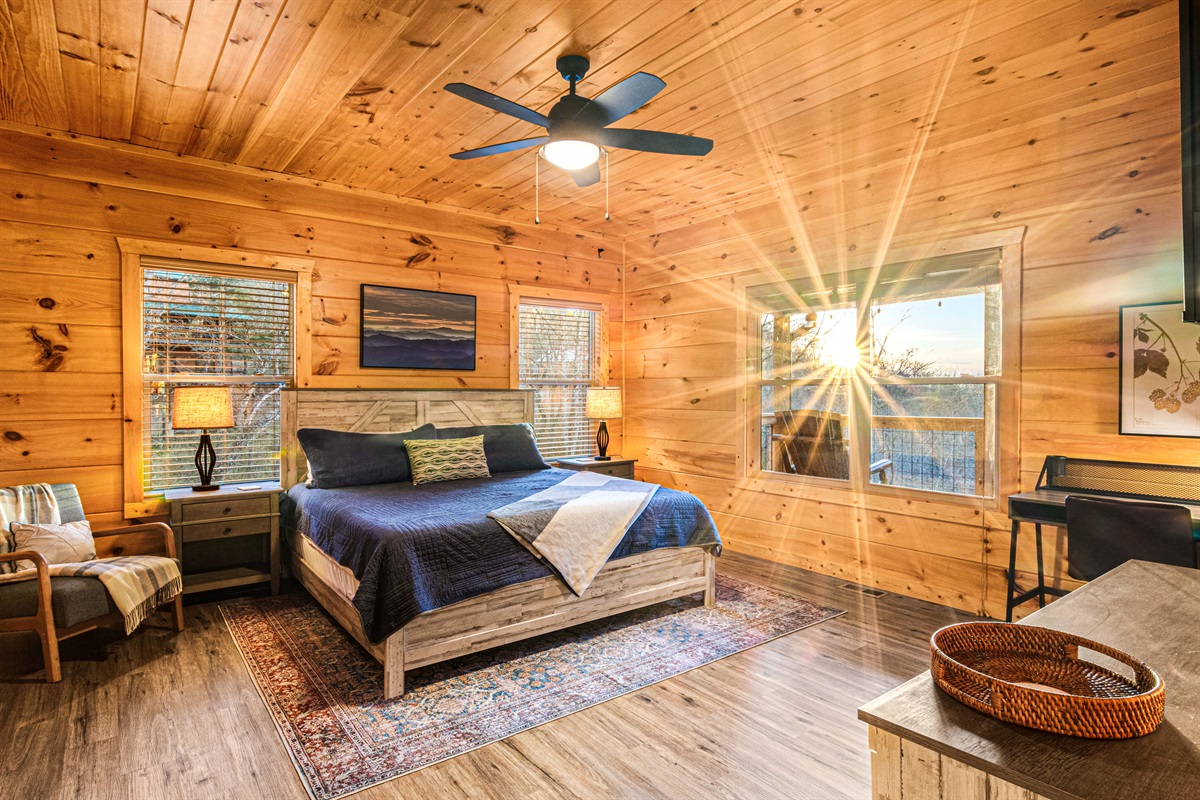 Primary bedroom with morning sun and seasonal mountain views