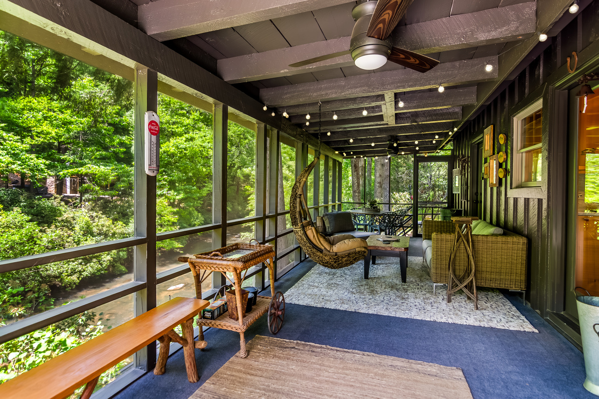 Screened in porch overlooking the river 
