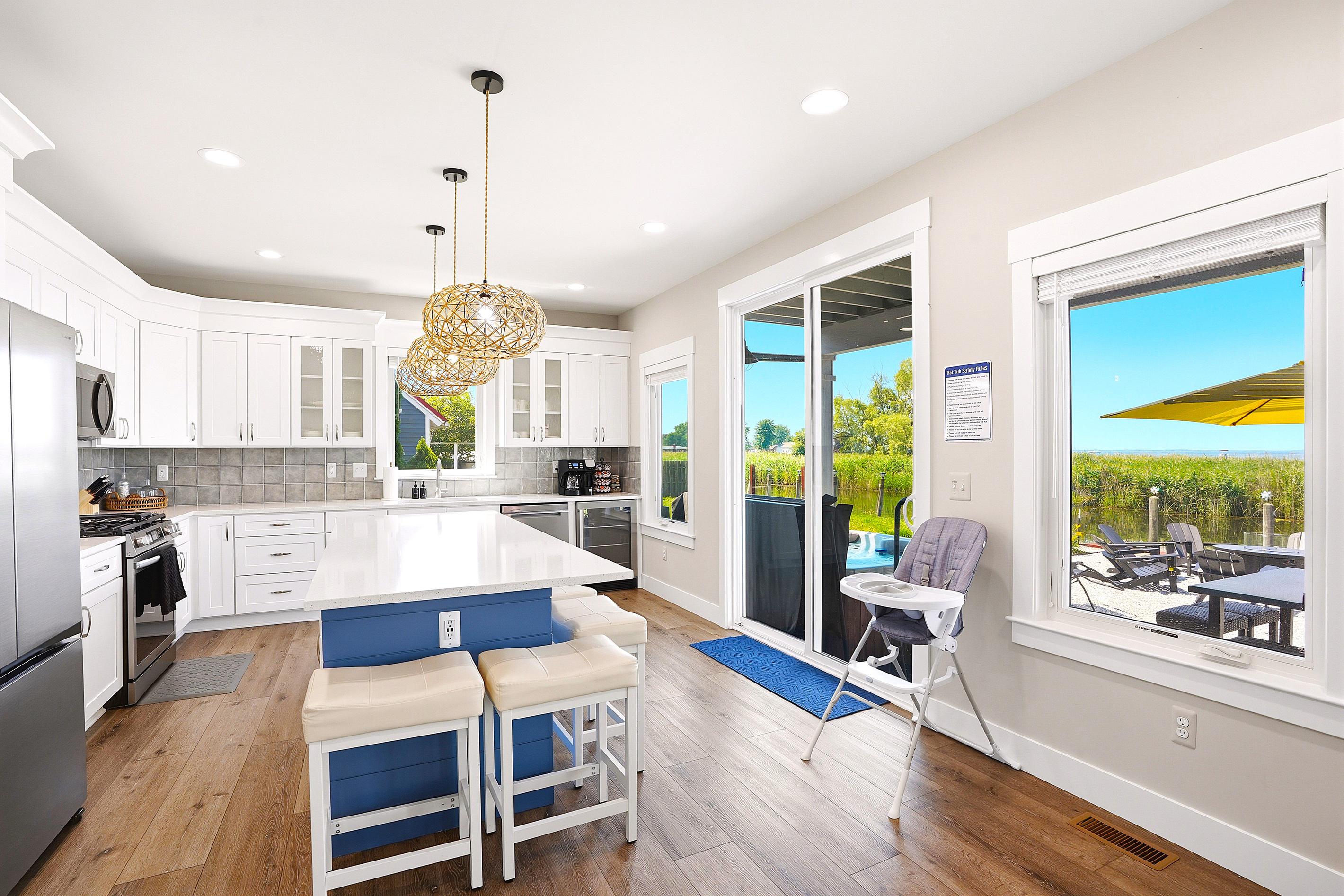 Whether you're cooking breakfast or gathering after a day on the lake, this open kitchen keeps everyone connected with beautiful waterfront views nearby.
