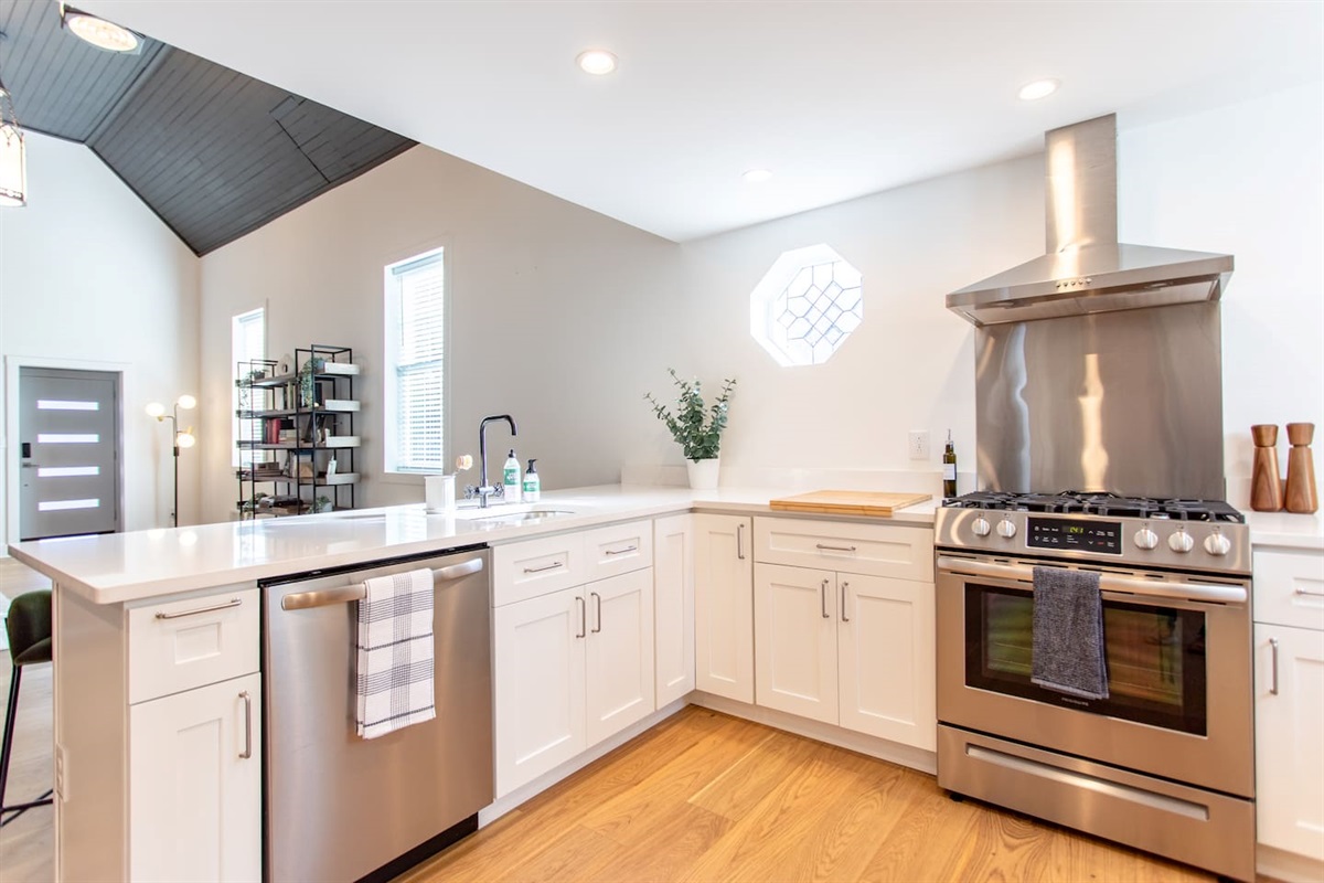 Fully equipped kitchen with modern appliances, including a stove, oven, refrigerator, microwave, and all the necessary cookware and utensils to prepare your meals with ease.
