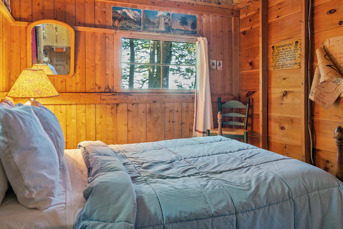 Layout detail at Loonrise Point: Note the partition wall on the right does not reach the ceiling, allowing light & sound to carry to the living room. Authentic open-rafter camp design on Beech Hill Pond in Otis, ME.